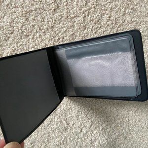 - 5 Bank ID Card holding pockets in one compact waterproof wallet